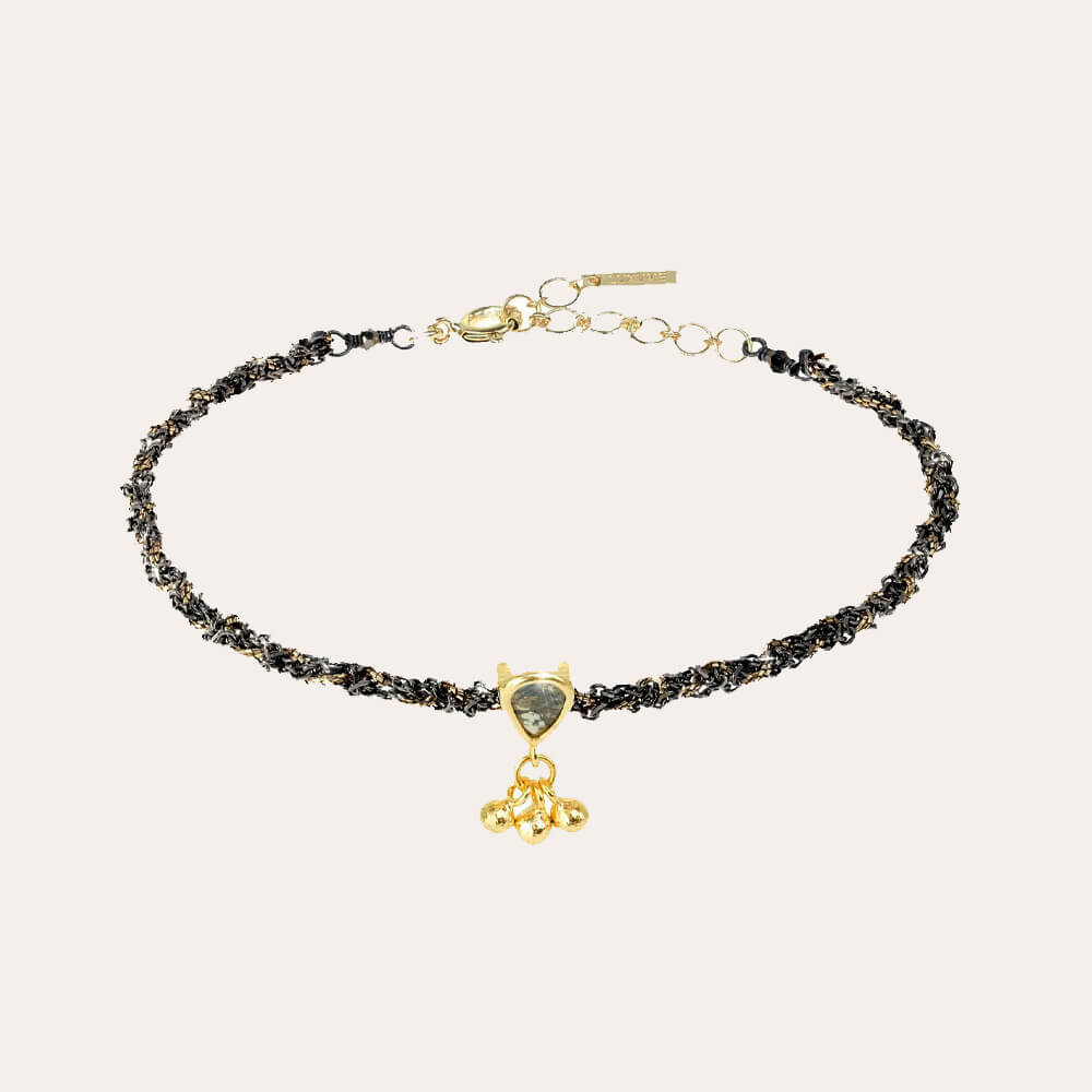 Pulsera fina trenzada con oro y rutenio negra